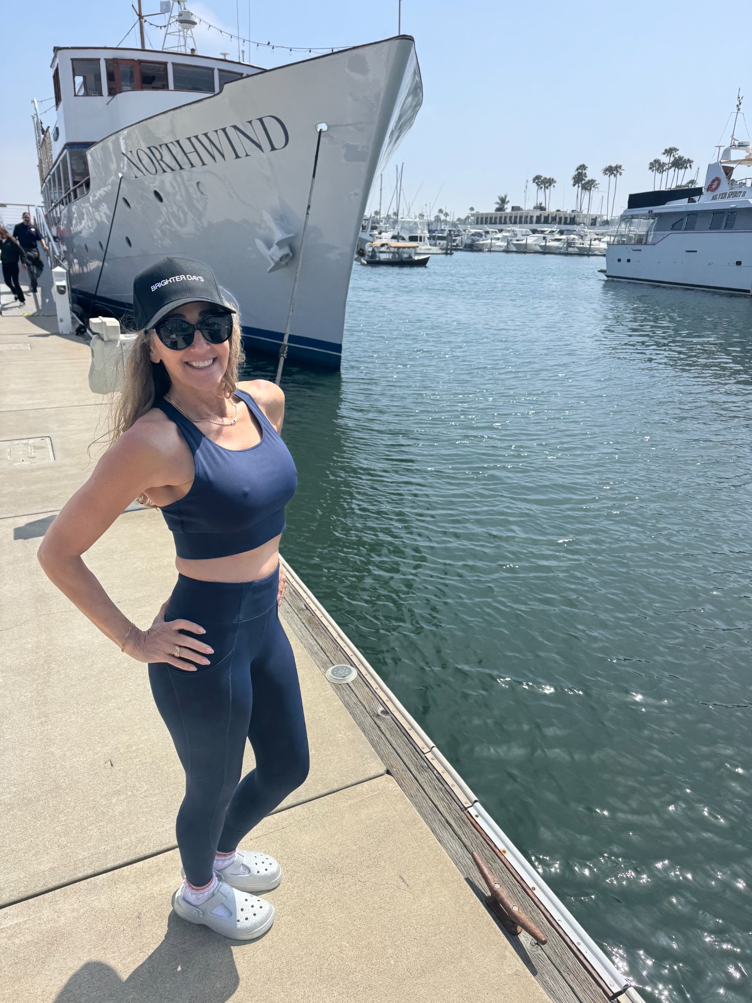 Renay Compere by the yacht in Marina del Rey