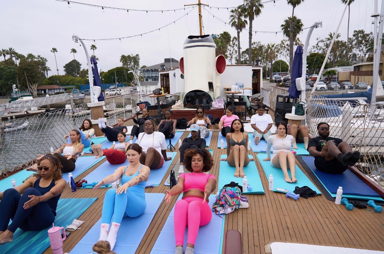 Pilates class on mats across the yacht deck